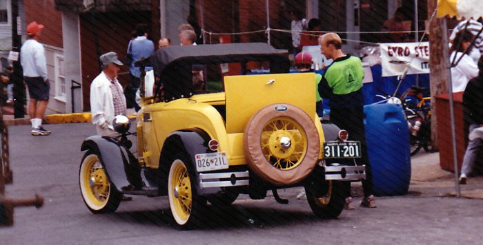File:Veterans Day Parade (No Date Given) - Ray E. Lucas Sr. and his 1930 Model A car parked on the street.jpg