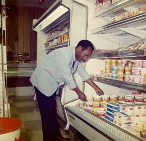High's---Lawrence Harris stocking the dairy case..jpg