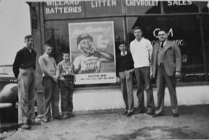 Russell Litten (right) posed with some local boys.jpg