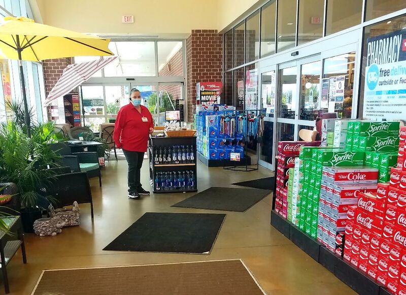 File:Pandemic 2020, Weis Employee checking customers in, only 215 allow in the store at one time..jpg