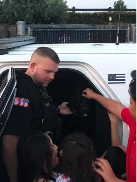 File:Officer Brandon Smith (K9) and Trex enjoying some quality time with the children. Thanks to Chief Milt Frech, August 2018.jpg