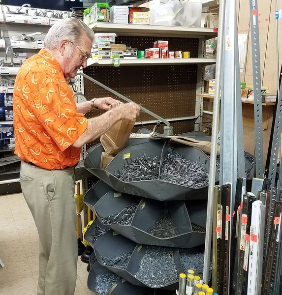 File:Brunswick Hardware Owner Leroy Strawsburg getting nails ready for a customer, July 7, 2017 in Brunswick. Photo Jerry Knight.jpg
