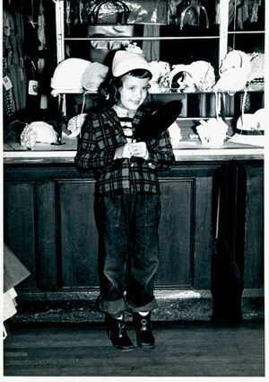 Monica McLane at Kaplon's modeling a nice hat.jpg