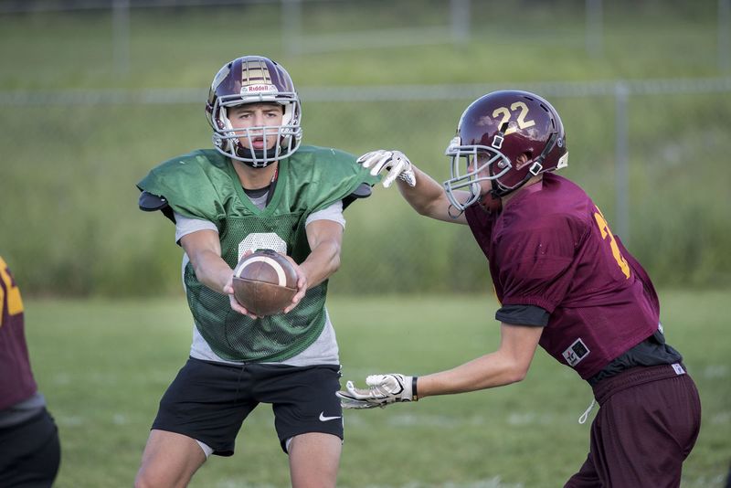 File:Football 2017, Quarterback Kadin Roberts prepares to hand off the ball to running back Layne Harich during practice September 14. Photo from FNP, Photo Bill Green.jpg