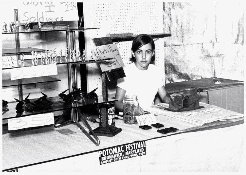 File:Daphne Harrington looking official at a booth.jpg