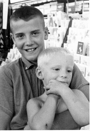 P.L. Orrison holding his little brother, Chris at Kaplon's.jpg