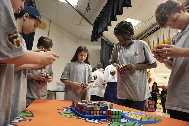 File:Members of the Brunswick Middle School Cube Slayers team race to solve 25 Rubik's Cubes, March 2, 2019 (1).jpg