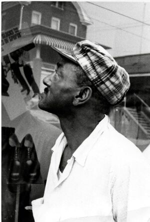 John Howard browses the window display at Kaplon's.jpg