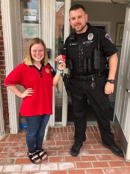 File:American Legion 2019 Mikenna Rogowsky delivered poppies to our town's Police Department and City, she is shown giving Officer Brandon Smith a poppy May 24, 2019.jpg