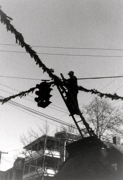File:Stringing Christmas greenery across the wires between West Potomac Street and Maryland Avenue.jpg