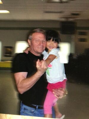 Bill Turney and adopted granddaughter Gracie.jpeg