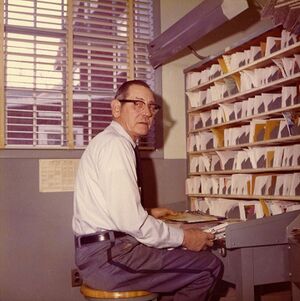Post Office, Harwood (Doc) Watson casing the mail.jpg