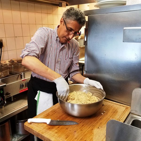 File:Potomac Street Grill Owner Abed Alkteifan preparing crab cakes, July 7, 2017 in Brunswick. Photo Jerry Knight.jpg
