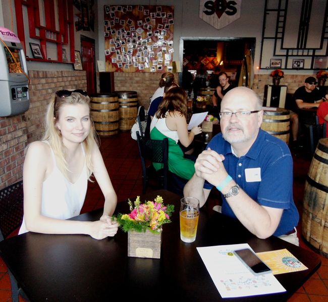 File:Main Street A Taste of Brunswick 2019 Sophie Smith and Councilman Andy St John discuss some business before the even.jpg