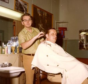 Ken Harshman barbering at the YMCA in the early '70s.jpg