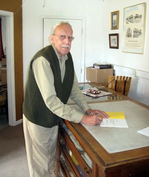 Pete Maynard signing one of his books.jpg