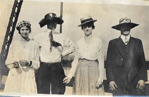 People on old bridge with Switched Hats.jpg