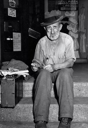 Traveling man on the steps of Kaplons.jpg